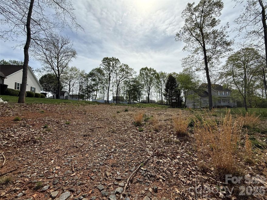 Good sized lot- nearly 1/2 an acre - Cleared and ready to go! Conveniently located in a well established neighborhood with street lights just minutes from I-40. Septic Permit has been revoked by Iredell County and septic area has been cut and damaged per Iredell County and currently can not support a septic system. Seller is discussing hiring a soil scientist to determine options.