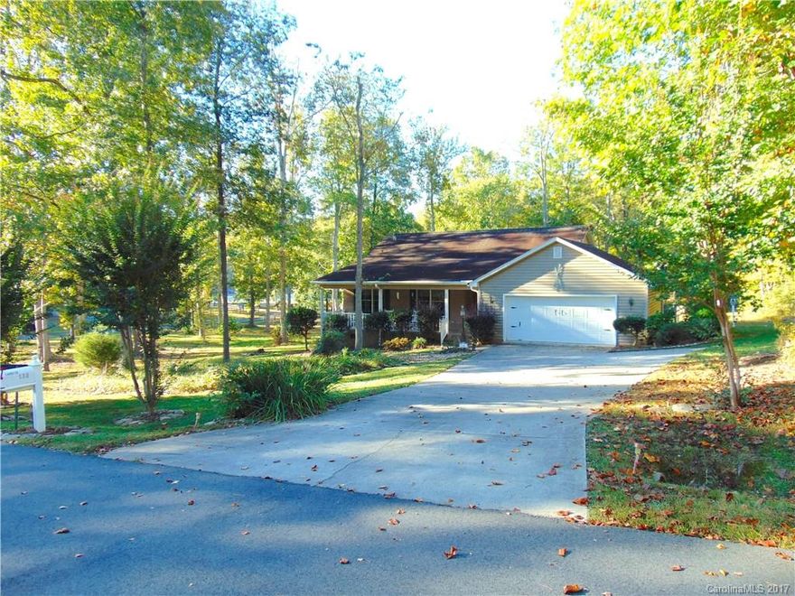 Beautiful home in waterfront community. Property offers year round views of High Rock Mountain, the highest mountain of the Uwharrie range, and High Rock Lake, the second largest lake in the Carolinas. Open floor plan w/vaulted ceilings, 3 bedroom, 2 bath, fireplace as well as panoramic views from the open and screened decks. Walk 250' to the private beach area and enjoy the wildlife up close. Community offers pool, tennis courts, marina clubhouse, boat launch & storage, beach area & more.