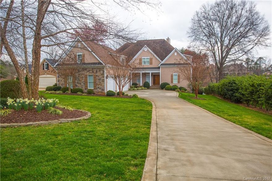 Two Story Waterfront home in Cornelius with a 3 car garage and a private dock. Master suite on the main with huge master closet. Main level hardwoods with a two story living room with vaulted ceilings, fireplace and great water views. Covered patio overlooking the lake and outdoor fire pit. Kitchen has stainless steel professional grade appliances. Upstairs has 3 additional bedrooms as well as a huge bonus accessible by a private staircase. Outside has a private covered dock and sandy beach.