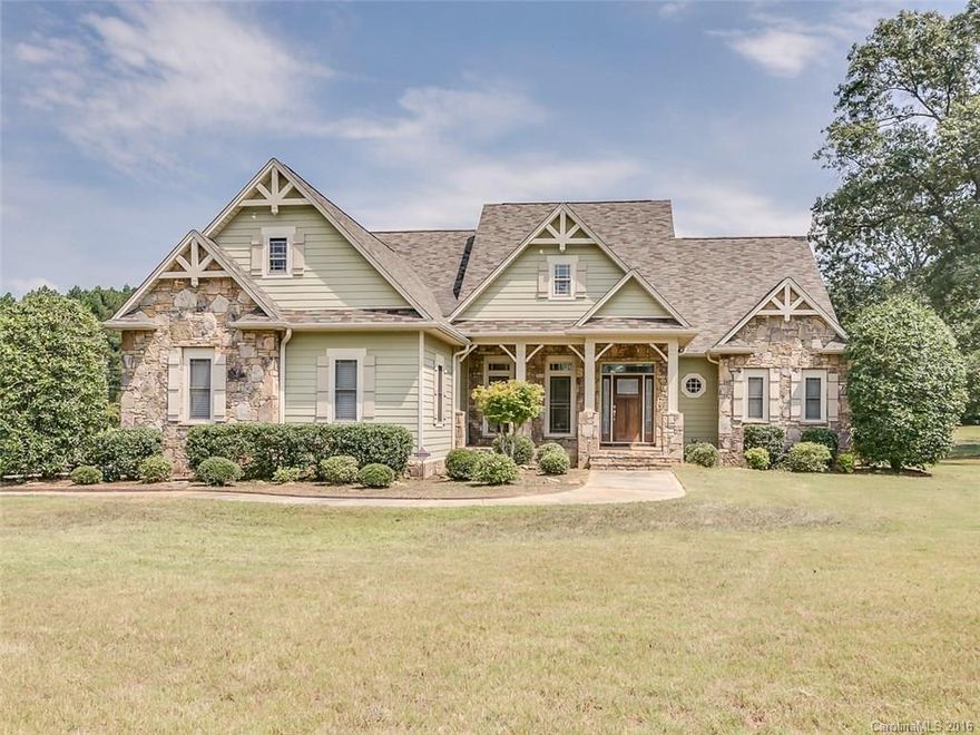 Gorgeous 5BR/3.5BA home w/exquisite finishes.  Formal DR, 2 sty GR w/gas log FP flanked by built-in bookcases, beautiful kitchen w/custom cabinets, granite, center island, 5 burner Bosch gas cooktop. Open concept to a large breakfast room w/octagonal tray ceiling & hearth room w/exposed beams & stained bead board ceiling & stone gas log FP.    Security system, intercom, hardwood/tile/carpet floors & much more!  The pictures don't lie- you must see to appreciate.