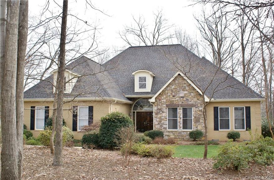 Gracious Lk Norman waterfront.This stone & brick ranch was designed to maximize lake views &
natural light. Beautiful hardwoods, 12 ft ceilings in family & dining area. Lovely architectural details:built ins, 5 sets French doors, arched doorways w/crown moldings. Gorgeous master suite w/view of the lake.Relax on screened-in porch or large outdoor patio, soak in the hot tub, enjoy your private dock, w/covered boat slip & lift.Large kitchen is a chef's dream overlooking a roomy, bright sun room.