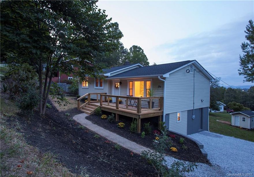 Beautifully updated home on large lot! Gorgeous kitchen & bathrooms, new stainless steel appliances, new butcher block countertops, hardwood floors, new lighting, new roof, new deck, large bedrooms... but wait until you see the VIEWS!  Year around long range mountain views w/ winter views of Biltmore Estate.  Huge backyard w/ lovely landscaping & 140 sq ft insulated building/play house. Minutes from restaurants, shopping, Blue Ridge Parkway, French Broad river, Bent Creek Forest, I-26 & I-40.