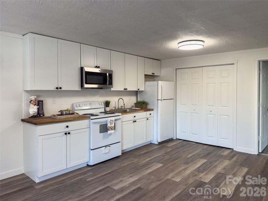 NEW PRICE! Cute NEWLY updated 2 Bedroom Cottage! Includes a nice sized detached garage which could make an amazing workshop and great for storage! Set off the road up a driveway this one is perfect for those needing a convenient location near 321 and hwy 150, with Chick-Fil-A and Starbucks right nearby! Recent updates include new kitchen cabinets, flooring, paint and trim.