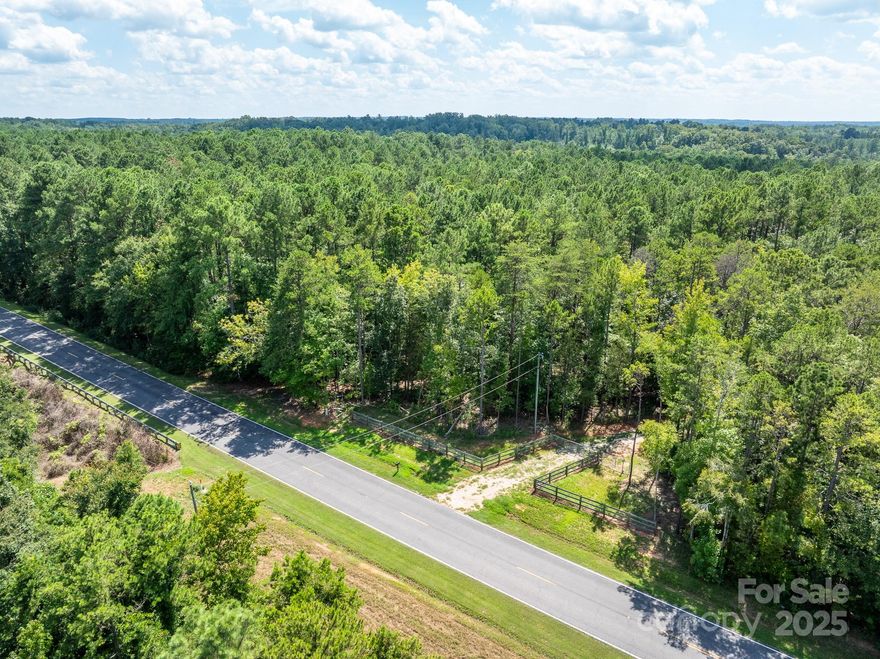 Discover approximately 66 acres of versatile land in Chester, SC, with frontage on Center Road and zoning of R-2, allowing for both residential and potential commercial uses. This expansive property offers endless opportunities—from creating a rural homesite conveniently located between Charlotte, NC and Columbia, SC, to enjoying an excellent hunting retreat, or exploring investment and commercial development options.
The land features a mix of hardwoods and pines with timber over 20 years old, natural regeneration, and several flat, elevated areas ideal for building. Two established food plots and a series of trails run throughout the property, making it easy to explore and enjoy.

Improvements & Inclusions:
30’ x 40’ metal barn with a 15’ x 40’ covered porch, complete with well water and electricity
2020 55HP Kubota tractor, 2018 28’ Gulfstream camper, and various farming and hunting equipment included with the sale.

Location Highlights:
10 minutes to downtown Chester, SC
30 minutes to downtown Rock Hill, SC
Approximately 1 hour to Uptown Charlotte, NC and Downtown Columbia, SC

Investment Highlights:
65.66 acres with Center Road frontage
Zoned R-2, supporting residential, recreational, and potential commercial uses
Newly constructed barn with utilities
Valuable equipment and camper included
Multiple buildable areas with scenic views
Established food plots and extensive trail system

This property offers a rare blend of convenience, utility, and natural beauty—an outstanding opportunity for investors, outdoor enthusiasts, or anyone seeking a large tract of land with income-producing and recreational potential.