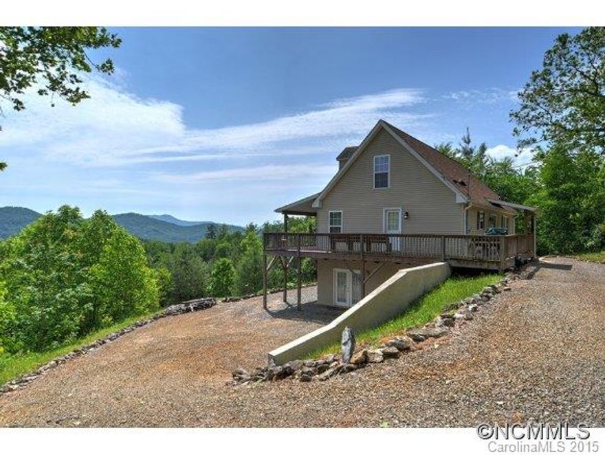 Panoramic views - Large three level Home. Easy to Live on Main with Master and Second Bedroom.  Upstairs is an additional 2 rooms that join through a hall and full bath. Work shop in basement preframed for 2 garage doors with large recreation room with outdoor access, plumbed for 3 bath. Gourmet kitchen with Oak cabinets and corrian counter top. Decks on 3 sides the front one is covered. Includes additional lot with home sites already in and well