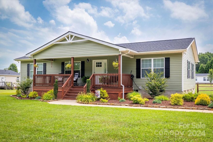 This updated and stylish one-level home has so much to offer for a great price! You will love the split bedroom floor plan and open living room/dining area. The home offers brand-new wide plank LVP flooring, light fixtures, wood blinds, roof, and HVAC in 2022. Enjoy the spacious primary bedroom with a walk-in closet and private full bath offering a dual vanity. Great kitchen with newer granite countertops, SS appliances, breakfast bar, and sliding door to the back deck. There are 2 other ample-sized bedrooms and a full bath on the other side of the home, along with a laundry room. The outside of the home is just as beautiful with a covered front porch, fire pit area, and totally level lot with fencing. Find plentiful storage in the 12x24 building and attached storage closet at the back of the home. Easy maintenance and so clean... it won't disappoint! Even better... no city taxes, water, or sewer bills.