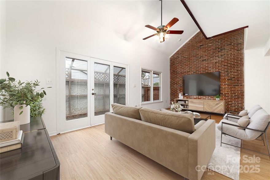 SELLER IS MOTIVATED!  All offers will be considered. Located in Charlotte's historic Fourth Ward, this charming townhouse offers a unique blend of historical ambiance and modern urban living. The three-story, 1,283-square-foot residence provides a comfortable and convenient lifestyle, with the heart of Uptown Charlotte just minutes away. This townhouse features a classic design that complements the historic charm of the neighborhood. With 2 bedrooms + a loft and 3.5 bathrooms: The spacious layout provides ample living space and beautiful exposed red brick walls. The 3rd floor could be used as  a bonus room or office and has full bathroom. The interior boasts a welcoming open-concept feel, complete with multiple balconies with views of the city.  Step outside to a private outdoor space, perfect for relaxing or entertaining. This may be the best chance to get into 4th Ward at this price point! Opportunities to customize this home into your perfect oasis make this townhome a must see!Brand new Roof, freshly painted exterior and interior, new flooring throughout. 

Highlights of the Historic Fourth Ward: The Historic architecture. The neighborhood is renowned for its beautifully preserved Victorian homes, tree-lined streets, historic buildings and neighborhood parks. You are steps away from Uptown's abundant restaurants, shops, and entertainment venues.

Nearby attractions: Enjoy easy access to Fourth Ward Park, the McColl Center for Art + Innovation, the AvidXchange Music Factory, and the Discovery Place science museum.

Excellent transit access! The neighborhood is well-served by Charlotte Area Transit System buses and is close to the LYNX Blue Line light rail.

This property is a fantastic opportunity for anyone seeking an urban lifestyle within a picturesque and historic setting.