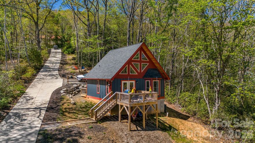 Two fully furnished homes set on 2.44 private acres along Flat Top Mountain Road—offering flexibility, income potential, and modern mountain living just minutes from Asheville. Currently operating as successful Airbnbs, this property is ready to step right into.

Built in 2023, the main home is a beautifully crafted log cabin featuring 3 bedrooms, 2.5 baths, and an open, light-filled floor plan with modern finishes that complement its mountain character. The second home offers 2 bedrooms and 1 bath—ideal for guests, multi-generational living, or continued rental income.

Both homes feature upper-level loft bedrooms open to the main living spaces, creating a warm, airy feel. Positioned to maximize privacy while still functioning as a cohesive property, the layout allows for multiple uses—live in one and rent the other, host family and friends, or continue operating both as income-producing properties.

The 2.44-acre setting provides usable outdoor space and a peaceful mountain backdrop, with an additional lot included for future flexibility or expansion.

Property infrastructure includes a 5-bedroom septic system with two separate tanks sharing a drain field, along with a shared well.

Turn key, versatile, and ready to go—this is mountain property that gives you options.