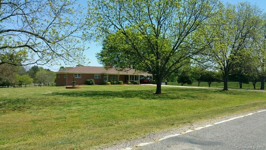 Great family home place. Brick Ranch with full finished basement. Sun room,Fabulous Barn and fencing.  Hardwood floors. This house has a lot to offer. The nine acres are beautiful.