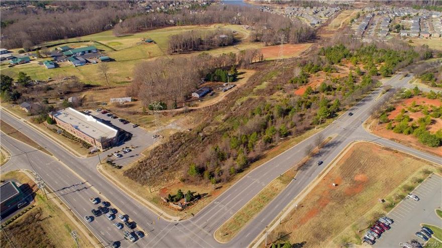 Over 14 acres of prime real estate positioned on Brawley School Rd and Morrison Plantation Parkway. Easy access
to I-77, Highway 150, Trump National Country Club. Property has many options for development. Buyer to pay for all utility tap fees