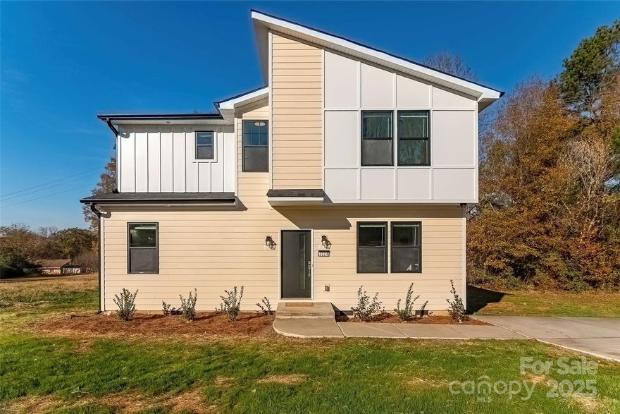 Modern New Construction in Brittain Village – Shelby, NC!
Welcome to this beautifully crafted 4-bedroom, 3 1/2-bath contemporary home offering standout design, premium finishes, and turnkey convenience. Situated on a large open lot, this home features a sleek modern exterior, a large concrete driveway, and clean architectural lines that immediately set it apart.

Step inside to a bright, open-concept layout highlighted by luxury vinyl plank flooring, recessed lighting, and abundant natural light pouring through oversized windows. The spacious living area flows seamlessly into the showpiece kitchen—complete with quartz countertops throughout the entire home, all-white soft-close cabinetry, stainless steel appliances, and a striking herringbone tile backsplash.

This exceptional floor plan includes two primary suites, each with its own private bathroom. Every bathroom in the home showcases modern, custom tile work, matte black fixtures, quartz vanities, frameless or sliding glass shower doors, custom shower niches, and high-end lighting. One upstairs primary bath even features dual sinks and a large quartz vanity.

Upstairs, you’ll find additional bedrooms, a wide hallway landing, and beautifully finished spaces perfect for family, guests, or a home office.

Step out the back door onto the rear deck—ideal for grilling, relaxing, and enjoying the privacy of the open backyard. With a flat and usable lot, there is endless potential for outdoor living.

This home offers a perfect blend of function, beauty, and modern craftsmanship. A true turnkey opportunity in the heart of Brittain Village!