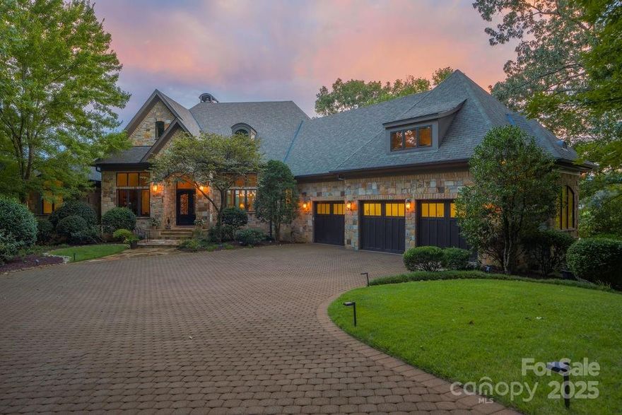 The Gem of Cliffs Valley: A Story of Unrivaled Views and Mountain Majesty There are places that capture the imagination, and then there are those that redefine it. Welcome to 15 Water View Court, a property so iconic it has graced the cover of the Cliffs Valley golf scorecard and has long been whispered about as “The Gem” of this prestigious community. Perched on a private 270-degree peninsula, 40 feet above the emerald fairways, this is more than a home—it is a legacy, a sanctuary, and a front-row seat to the breathtaking theater of the Blue Ridge Mountains. From the moment you arrive, the world outside falls away, replaced by a sense of tranquility and awe. The estate’s 1.5 acres of meticulously landscaped grounds offer a level of privacy that is simply unattainable elsewhere in the community. Here, you are surrounded by nature’s grandeur, with no close neighbors to interrupt the symphony of rustling leaves and distant birdsong. Yet, the convenience of the Cliffs Valley gatehouse and clubhouse remains just a short stroll away, offering the perfect balance of seclusion and community. The home itself, a masterpiece by premier builder Alora, is a testament to architectural excellence and thoughtful design. Step inside, and your gaze is immediately drawn through walls of glass to the stunning panorama beyond. The 25-foot ceilings of the great room soar towards the heavens, while a magnificent stone fireplace provides a warm and inviting anchor to the space. Every room is a vantage point, offering ever-changing views of the Ben Wright-designed golf course, the shimmering lake, and the majestic mountains that stretch to the horizon. This is a home built for both grand entertaining and intimate moments. The gourmet chef’s kitchen is a culinary dream, with custom cabinetry, professional-grade appliances, and a massive center island that invites family and friends to gather. The seamless flow into the dining room and the elegant butler’s pantry ensures that every occasion is effortless. For moments of quiet reflection, the sunroom lounge offers a 270-degree embrace of the surrounding beauty, a place to savor your morning coffee as the sun crests the mountains. The main-level primary suite is a sanctuary of its own, with a curved wall of windows that frames the stunning landscape like a living work of art. A cozy fireplace, a spa-inspired bath, and a private sitting area create a retreat where you can rejuvenate your body and soul. The terrace level is an entertainer’s paradise, complete with a second full kitchen, a wine cellar, and a state-of-the-art golf simulator. A private gym, steam shower, and sauna offer a wellness experience that rivals the world’s finest resorts. Outside, the expansive flagstone terraces and screened-in porch with its own fireplace provide the perfect setting for alfresco dining, sunset cocktails, or simply unwinding to the gentle sounds of the cascading waterfall and koi pond. This is a place where memories are made, where stories are told, and where the beauty of the mountains becomes a part of your soul. 15 Water View Court is not just a home; it is a lifestyle. It is the thrill of a morning round of golf on a world-class course, the joy of an afternoon hike on a private trail, and the peace of an evening spent watching the stars blanket the mountains. It is a place where you can connect with nature, with your loved ones, and with yourself. This is your opportunity to own a piece of paradise, to live the story that only “The Gem of Cliffs Valley” can tell. Cliffs Membership Available with access to 7 world class clubs.