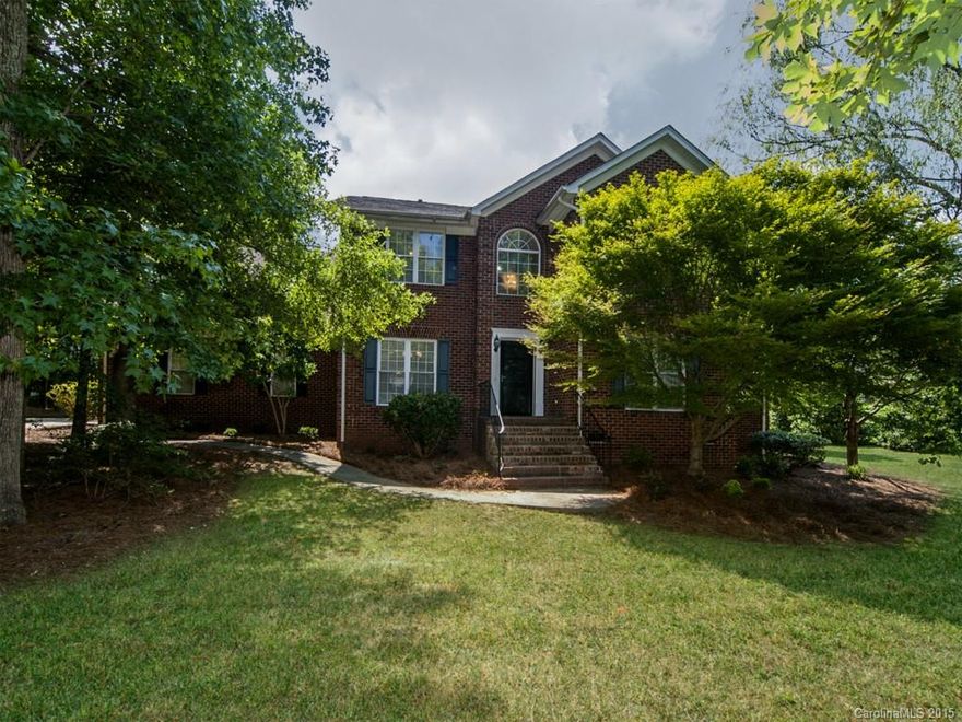 Beautiful all brick home on a large corner lot with side load garage. Spacious, updated kitchen with granite counters and new stainless steel appliances. Hardwood floors throughout the main level with a great room. Master is on the main with 2 walk in closets. Master bath has dual vanities and a vaulted ceiling. A loft area has built-ins. Extra large bonus room upstairs could be 4th bedroom. Whole house freshly painted plus new hardware, lighting, plumbing fixtures and fans throughout.