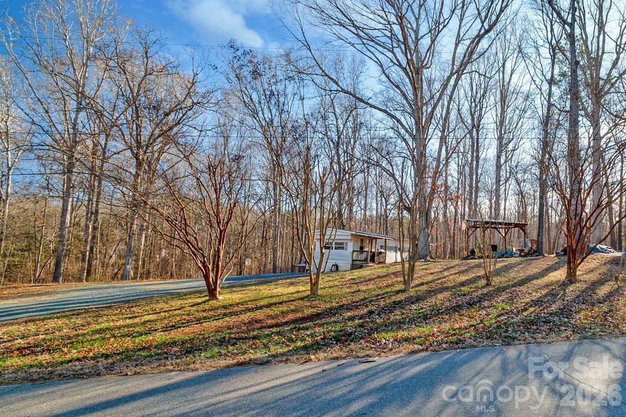 Welcome to 4125 Glenola Drive, your opportunity to own a piece of Waxhaw with space, flexibility, and no HOA. Located just minutes from the charming and historic town of Waxhaw, this 1.045-acre property in Wisackola Park offers a peaceful setting while still being close to local shops, dining, and community events.

The property currently includes a small two bedroom trailer.
 Buyers may choose to keep it, remove it, or move forward with a new custom or modular build. An existing well and septic are already in place and may be usable for future construction; however, both would need to be inspected and approved for use.

With no HOA restrictions and nearly an acre of land, this property provides a rare opportunity to create your vision—whether building now or planning for the future. Opportunities like this in Waxhaw don’t come often—hurry to secure your spot in this sought-after area.

The septic permit is attached and is for a 3 bedroom home.