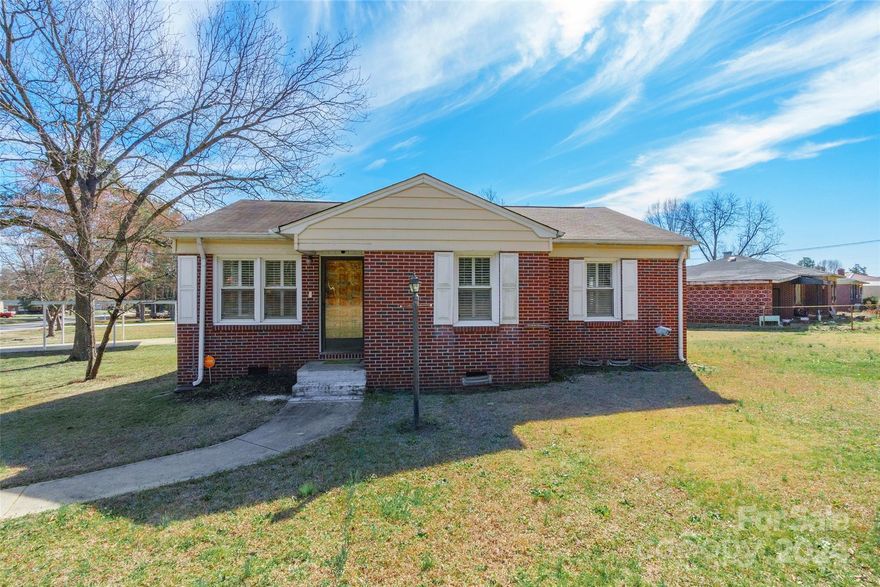 Welcome to this charming brick ranch nestled on a corner lot spanning over half an acre, offering both space and comfort. Step through the front entry into a cozy living room and adjacent office room, perfect for unwinding or working from home. The adorable kitchen boasts granite counters and has been tastefully updated, while the bathroom underwent a remodel in 2022. Hardwood floors grace the kitchen, with the original hardwood extending under the carpeted areas. Enjoy the convenience of plantation shutters and exterior cameras that remain with the home. A convenient mudroom off the back porch includes the laundry area, adding functionality to everyday tasks. Outside, the spacious yard beckons with a firepit, perfect for gatherings, and a workshop with electric for projects or storage. With its delightful features and prime location, this home offers the perfect blend of comfort and convenience. Don't miss the chance to make it yours!