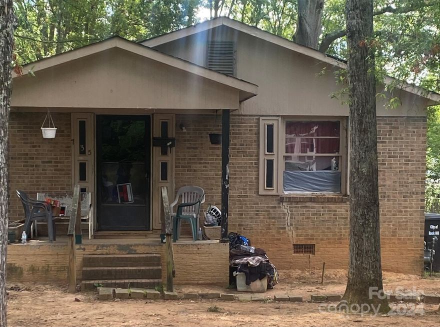 Charming 3-bedroom, 1-bathroom ranch-style home located in downtown Rock Hill, offering a great investment opportunity despite foundation issues. The property features a spacious layout with potential for renovation and customization. Situated in the desirable Downton Rock Hill area, close to shops and restaurants. Convenient to Winthrop University and Clinton College. Ideal for investors looking to restore and enhance this promising property.