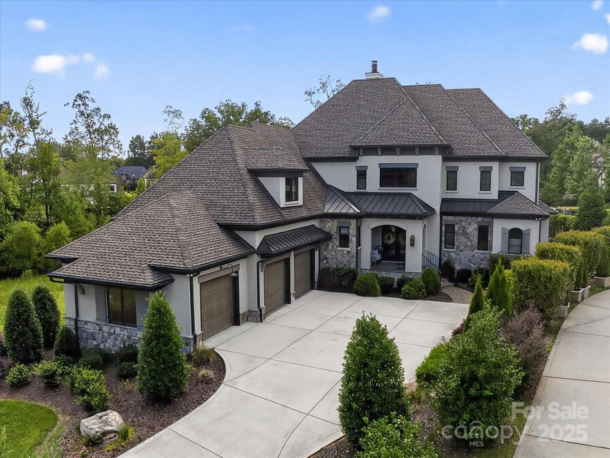 LUXURIOUS newer construction home (2021) in popular Skyecroft community located on premium lot with amazing resort backyard and beautiful water view. This home exudes sophistication with features such as contemporary front double glass doors, custom built ins in Great Room with designer wall details and floating shelves, high end lighting, fresh neutral paint and white oak hardwood floors. The center point of this home is the beautiful kitchen with ceiling height cabinetry featuring both under counter and in cabinet lighting, white oak custom island, commercial 6 burner gas range with double ovens, Subzero fridge and walk in pantry with additional beverage fridge and custom cabinetry. Unique floor plan features half level up primary suite featuring luxury bath, oversized walk in closet with well designed custom cabinets plus a dedicated home gym.  Up one level, you will find 3 additional secondary rooms, one with a dedicated full bath and 2 with an oversized shared jack and jill bath.  2nd floor also includes a large bonus room. The best part of this amazing home is the lower level that includes a light and bright rec room that features a gorgeous bar with custom waterfall edge island, ceiling height cabinetry and built in wine fridge that can accommodate up to 300 bottles.  Lower level opens directly to the pool patio. Outside, take in the great North Carolina weather on the beautiful covered screened porch or relax in front of the linear contemporary gas fire pit.  Lovely salt water pool is heated and includes a separate hot tub thoughtfully designed for privacy and views of the water. In addition to the well appointed interior, this home was built with an emphasis on functionality. Whether you are listening to music from one of the many rooms with built in sound system, or lowering the wireless controlled living room shades from the comfort of your sofa, there is no shortage of features that serve those that live here. The home is even equipped with a residential elevator with stops on the second level, main level, lower level, and garage. Other features include spray foam insulation, tankless hot water heater, encapsulated crawlspace with dehumidifier. Wonderful quality home! A+ Weddington Schools!