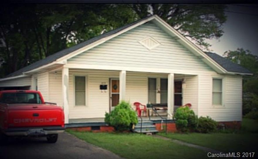 Cute 3 bedroom, 1 bath bungalow, corner lot in Cramerton. Home built in 1922. Owned by same family for over 50 years. Large rooms, hardwood floors everywhere but bath, kitchen. 3 non-operating, cosmetic only, fireplaces with original cast iron grilles. Clawfoot tub in bath. Kitchen has original drainboard sink. Nice front porch to enjoy small town life. 1-car attached garage. Lots of character. Estate Sale. Sold as-is. Sellers to make no repairs. Perfect remodel potential in desirable area.