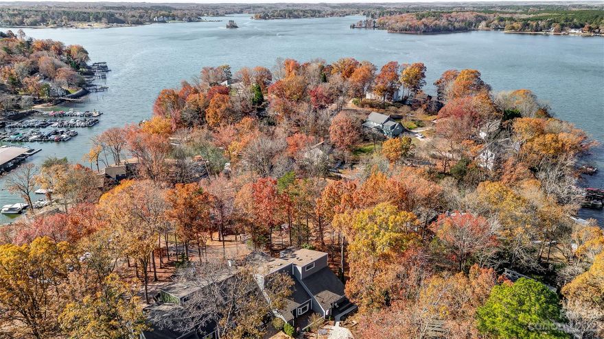 WATERVIEW WITH DEEDED SHARED DOCK! This home is in MINT condition. New beautiful kitchen and new tiled baths. Loaded with storage including walk in attic storage. All appliances stay including washer and dryer. Very large primary bedroom with walk in closet and gorgeous tiled primary bath. (Could have 3rd bedroom.) Hardwood floors, bar stays. Loads of entertaining space including decks, sunroom, a TV room with large TV console that stays. Charming front porch with trek deck. Workshop in basement and more finished storage. Screened porch. Extremely well maintained! Roof 2018. DEEDED DOCK #11.
HOA covers landscaping, tree trimming, leaf raking, community beautification, erosion control, sidewalks, parking lots and common areas. HOA does not cover anything with the home structure or dock/deck.