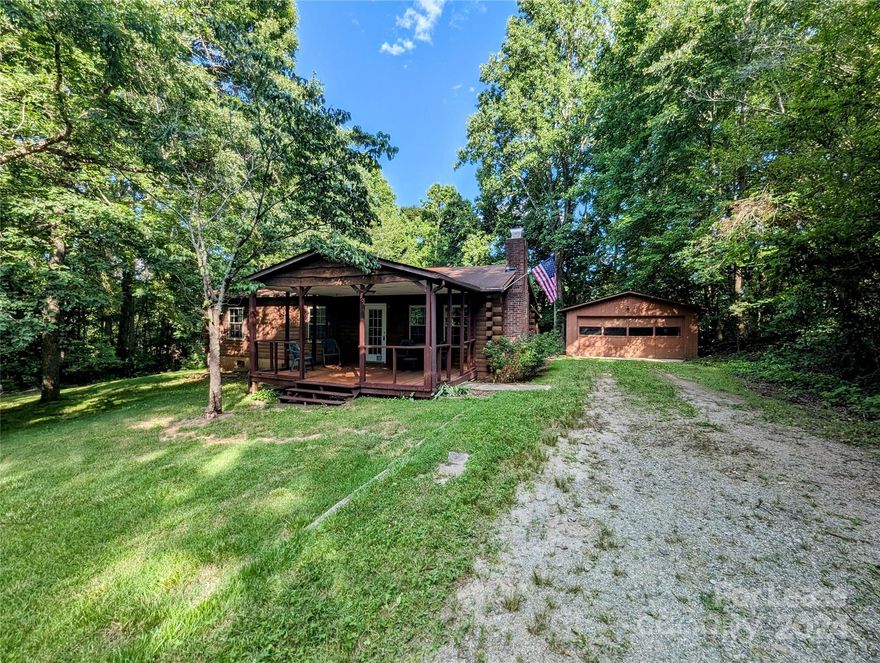 Discover the charm of this unique log cabin, perfectly nestled in a serene wooded setting. Featuring 3 bedrooms and 2 full bathrooms, this home offers comfort and tranquility. The detached 2-car garage provides additional storage space. Relax on the large rocking chair front porch or entertain on the spacious back deck. Enjoy a freshly painted interior and a large sunroom with endless possibilities. This private haven is conveniently located, offering the best of both worlds. Rent is $1650 per month with a $1650 security deposit. A $40 application fee per adult applies.  Pets are considered on a case by case basis and no smoking allowed. Don't miss out on this enchanting property!