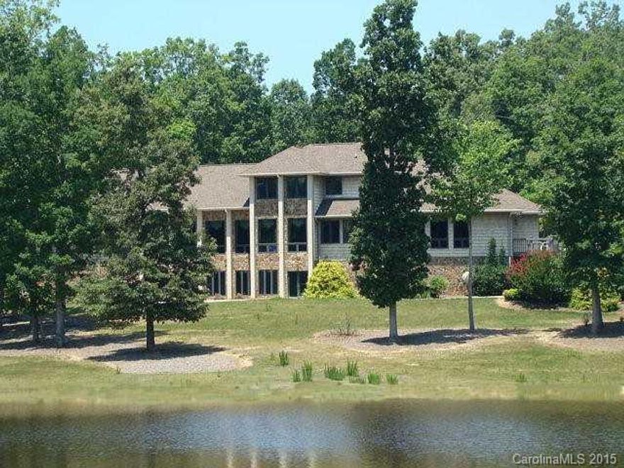 Secluded private estate on 104 acres! Property includes custom home with many exceptional features, beautiful 12 acre stocked pond (approx), 2 bedroom guest house & gated entrance. Main house built in 1998 has 4 car garage, 4 fireplaces, hardwood floors, granite counters, custom cabinets & moldings, finished basement w/additional rooms (could be BRs), wonderful water views throughout home! This beautiful property is close to Uwharrie National Forest & adjoins Birkhead Mountain & Wilderness area.