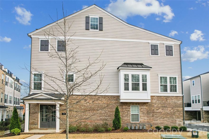 A perfectly positioned end-unit townhome in Elizabeth Glen! This boutique townhome neighbor within historic Elizabeth is known for its charm, tree lined streets, and close proximity to Uptown, Novant, Atrium, dining, and local favorites, 200 Emerson Avenue offers refined, low maintenance living in one of Charlotte’s most sought-after neighborhoods.  The lower level features a double door side entrance with a welcoming foyer and includes a private guest suite with full bath, and access to the attached two car garage with an extended eave that adds to the architectural charm. The Main level is designed for entertaining and everyday living with an open concept layout filled with natural light, tall ceilings, crown molding, and light natural oak flooring with warm undertones. The kitchen anchors the space with a six-burner gas range, built in microwave, wall oven, oversized island with seating for five, ceiling height cabinetry with glass accents and lighting. A private balcony and sunroom with plantation shutters extend the living area.  The upper level features a primary suite with a trey ceiling, dedicated seating area, two custom walk-in closets, and a spa inspired bath with dual vanity and oversized tiled shower with built in bench. A secondary bedroom with private bath and the laundry closet completes this level. The fourth floor offers a versatile bonus room with attached powder room and access to a private rooftop terrace, delivering exceptional living in the heart of Elizabeth! Walk to Plaza Midwood, Eastover and Myers Park! 

.