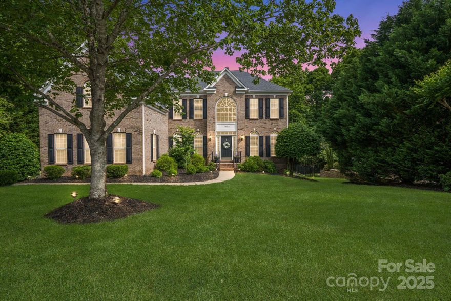 Welcome to this elegantly modernized home, thoughtfully designed across three levels. This 4-bedroom, 3.5-bath residence offers the perfect blend of work-from-home flexibility and family-friendly living. Step inside to soaring ceilings, newly refinished hardwood floors, and abundant natural light. The gourmet kitchen impresses with stainless steel appliances, granite countertops, a spacious island, and a walk-in pantry. The oversized primary suite is a true retreat, featuring tray ceilings, generous walk-in closets, and a spa-like bath. The expansive finished basement offers multiple flex rooms, a cozy fireplace, and a dedicated home theater—ideal for entertaining, fitness, or guest accommodations. Outside, enjoy a private backyard oasis with fireplace & fire pit. With top-rated Fort Mill schools, convenient access to a neighborhood pool, playground, and sports court, and nearby trails, shopping, and dining, this home invites you to live the lifestyle you’ve always dreamed of.