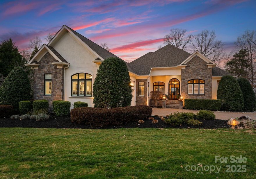 Welcome to "The Good Life", where luxury meets lakeside bliss. Experience luxury lakefront living at its finest! This fully updated Lake Norman estate boasts a rare sandy beach, pool, hot tub, and expansive terraces with stunning waterfront views designed for ultimate outdoor enjoyment. The gorgeous fully redesigned kitchen features Thermador appliances and exquisite finishes. The open main level features high ceilings and an open floor plan, perfect for entertaining.  The main-level primary suite offers a serene spa-like retreat, while the impressive lower level includes a gym, billiards area, and full kitchen—perfect for entertaining. Stunning water views from nearly every room enhance the home's elegance and tranquility. Thoughtfully curated with high-end finishes and exceptional craftsmanship, this home delivers the ultimate lakeside lifestyle with unmatched comfort and sophistication.