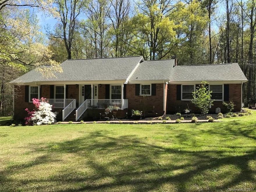 Cute as a button full brick ranch on two acres!  This one story home offers spacious rooms, upgrades and is in move-in ready condition.  Kitchen has large kitchen island with lots of counter space.  Great room is open to the dining room and sunporch - perfect for entertaining!  Master bedroom with en suite bath is a comfortable retreat. Nice and private, but in a great location in the Clover School District!  The lot is large and beautifully landscaped with it's own walking trail built right in!