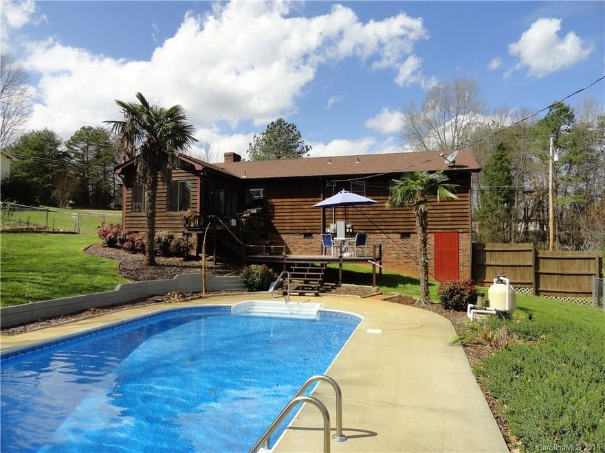 A hidden away diamond in the rough. Well kept and appears to be in great condition. 3 bedrooms and 2 full baths ranch home. New carpet, new laminate flooring, new water heater, new pool liner. Heated and cooled sun room which leads out onto a multi-level deck which leads to an in ground swimming pool. Home has a huge crawl space with plenty of storage that would almost qualify as a basement, outbuilding for lawn equipment storage, beautiful fenced in backyard with palm and banana trees.