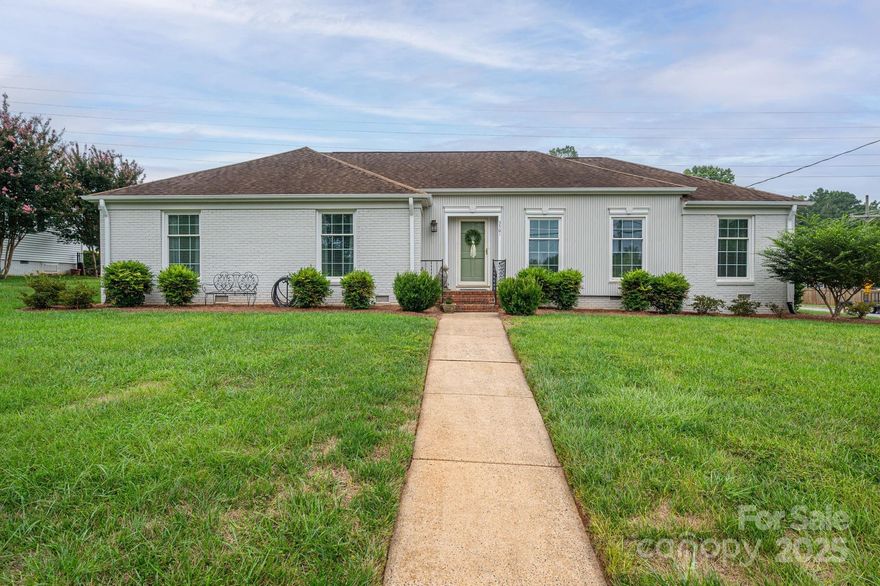 Welcome to this SPACIOUS & tastefully updated one-story brick home on a large beautiful level lot. This home features 3 generously sized bedrms, including an oversized primary suite with a custom walk-in closet & a luxurious bath complete with a standalone tub, tiled shower, double vanity. Gleaming hardwood floors run throughout—no carpet anywhere! The main bathrm has been fully renovated, & the home offers multiple living spaces including a living rm, family rm with a new gas fireplace (chimney inspected and cleaned), and a flexible dining rm or office. The kitchen is roomy with abundant cabinetry, & there's a large tiled drop zone & laundry rm off the back entrance. A spacious attic spans the full length of the home—great for additional storage. Freshly painted inside & out, the property also includes an attached storage rm, detached shed, & expansive front and back yards perfect for outdoor living/entertaining. Ideally located just minutes from I-85, shopping, and the hospital.