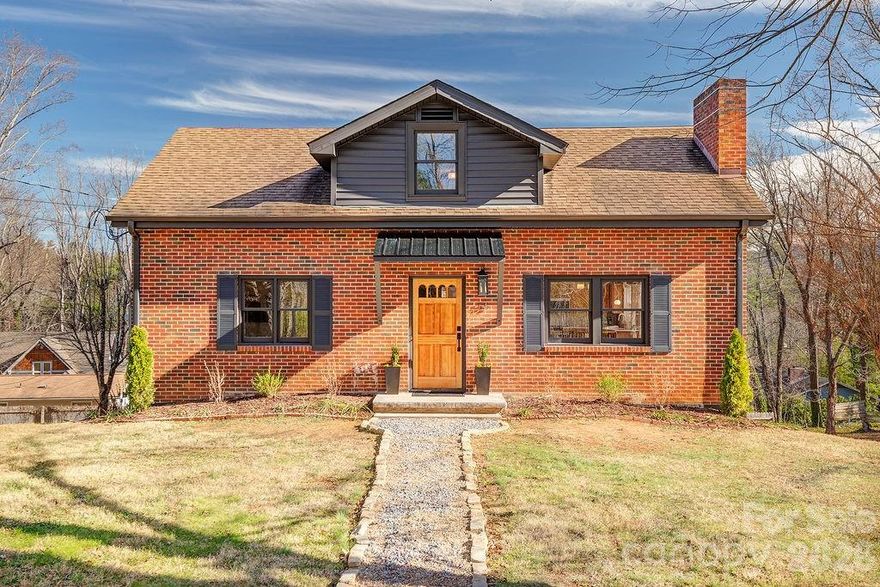 This is the home you’ve been waiting for in the desirable Haw Creek area — a fully reimagined, move-in-ready retreat that checks all the boxes. Thoughtfully remodeled from top to bottom, this spacious home offers four bedrooms and 2.5 bathrooms. On the main level, what was once two bedrooms, has been converted into a relaxing primary suite for winding down with a walk-in closet, a large spa-inspired bathroom with double vanity, a custom tile shower with gold rain head plumbing fixtures, and even its own in-suite laundry option for ultimate convenience.

The main living space flows seamlessly for entertaining, with a bright living room and dining room opening into the brand-new kitchen. Designed with both style and function in mind, the kitchen features oak cabinetry, Calacatta quartz slab countertops that wrap up the backsplash, and a full suite of General Electric White Café appliances — including a 5 burner range, double drawer dishwasher, a French-door smart refrigerator with hot and cold water dispenser, and microwave with air fryer feature.

This home’s improvements go far beyond the cosmetic. A new electric heat pump with triple-zone climate control, upgraded electrical service, almost all new plumbing and plumbing fixtures, new lighting, and freshly refinished hardwood floors. Step outside to enjoy the newly built deck, or spend time in the flat, usable front yard — perfect for play, neighborhood hangouts, and easy connection with friends.

The basement offers newly added finished space, thoughtfully designed for entertainment — complete with a projector plug-in for movie nights or game days. A one-car garage with a new garage door, a second laundry area, and stylish updates throughout add to the home’s convenience and flexibility.

Beautifully updated, centrally located, and designed for everyday comfort and connection, this Haw Creek gem is truly a rare find. Don’t miss your chance to make it yours in 2026.