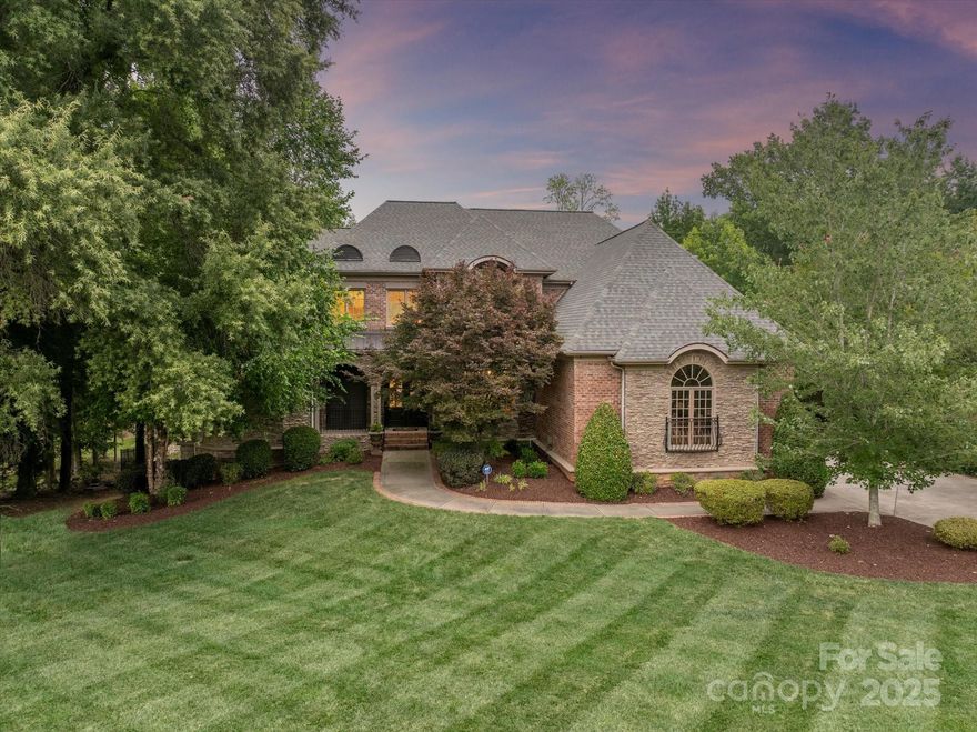 Beautiful 7500sf home with 4 car garage, walk out basement & beautiful salt water pool (2020) situated on a gorgeous 1 acre lot in the Weddington school district! Elegant brick & stone facade features a covered front porch & double front entry doors. Grand foyer opens to a stunning 2 story Great Room w/fireplace & built ins. Kitchen features recently painted cabinets, designer backsplash & huge walk in pantry. Main floor includes the primary suite + additional private office.Upstairs includes 3 oversized secondary rooms each w/an ensuite full bath + 2 bonus rooms. Finished basement includes a large guest suite w/full bath, full kitchen, billiards room with adjoining bar + a lower level garage! Perfect for long term guests or entertaining! The real gem of this property is the amazing outdoor spaces including a fenced yard, heated salt water pool, upper level composite deck. Newer HVAC! Roof replaced in 2020! Basement finished in 2020! Whole interior freshly painted!MOVE IN READY!