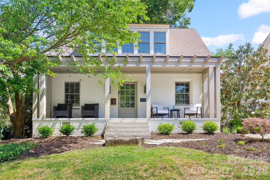Stunning cottage nestled on a quiet street in highly desirable Myers Park. Completely renovated in 2007 by renowned architect Ruard Veltman, this home showcases exceptional craftsmanship and high-end finishes throughout.
A charming front porch welcomes you, setting the tone for the thoughtfully designed interior. The main level features newly refinished hardwood floors, extensive crown molding, and a gracious lay out ideal for both everyday living and entertaining.
The primary suite on the main level opens to a private terrace. It includes dual walk-in closets with custom upholstered doors accented with nailhead trim. The luxurious bath offers dual vanities with concrete countertops and nickel faucets, a travertine-tiled walk-in shower with bench, rain shower faucet and a separate water closet.
The inviting living room features a gas fireplace with an English fire basket and flows seamlessly into the gourmet kitchen. Designed for both function and style, the kitchen and dining area includes bluestone countertops, custom cabinetry with designer hardware, a farmhouse sink with polished nickel Rohl faucet, quilted steel backsplash, upholstered accent panel with nailhead trim, and a French Lacanche 5-burner gas cooktop with electric oven.
Also on the main level is a secondary bedroom and a versatile office that could serve as a fifth bedroom. The office includes built-in cabinetry with antique brass hardware and a concealed washer/dryer. A hall bath features a Jacuzzi tub/shower with tile surround and a vanity with concrete countertop.
Upstairs, new carpet adds comfort to a spacious family room that opens to a deck with staircase leading to the patio and backyard. Two additional bedrooms feature charming Dutch doors and share a beautifully appointed bath. One bedroom includes a built-in upholstered twin bed with a trundle while the other offers a custom fabric headboard.
The upper-level bath is a true retreat with a marble-tiled walk-in shower, Kohler soaking tub, dual vanities with concrete countertops, woven wood tile accent wall, linen closet, and a separate water closet.
Outdoor living is equally impressive with a fenced yard, copper roof over kitchen,  garden shed, new patio, deck, and staircase perfect for relaxing or entertaining. Additional features include an architectural shingle roof, home speaker system (living room, kitchen, primary suite, and outdoor areas), custom grass blinds in most rooms and new landscaping and tree trimming.  Neighborhood amenities:  Freedom Park, Greenway, Park Road Shopping Center,  Reids, cute shops and dining on Selwyn Ave.  SHOWINGS BEGIN FRIDAY, MAY 15.