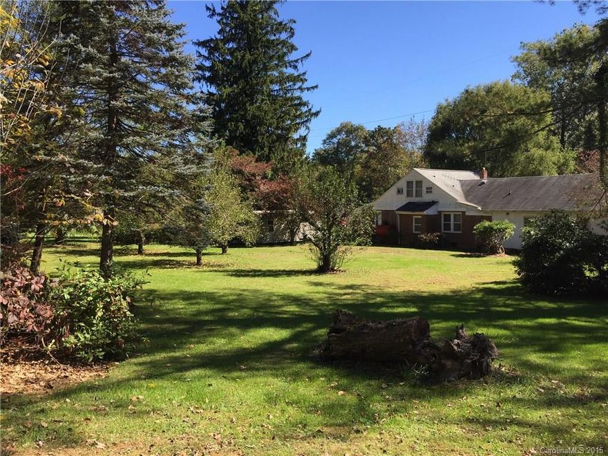 Large home on over half an acre in downtown Waynesville. Currently used as a seven bedroom home, but extra rooms could also be used for additional sitting areas, office, playroom, or a den. All rooms have closets, windows, and vents for HVAC, and some rooms adjoin with direct outside access. The home has an established staircase to a completely floored attic for lots of storage. There is also a formal dining room, two living rooms, and a wet bar. So many possibilities with this extra large SFR!