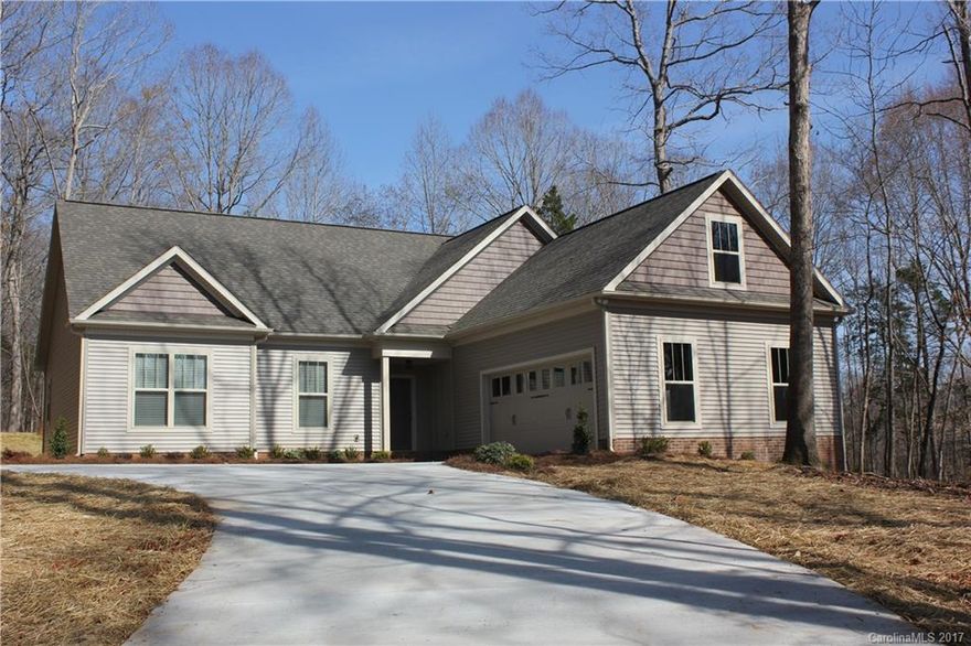 Retreat to this beautiful, two-year-old home on a quiet, private, cul-de-sac in the country! This light-filled home welcomes you with an open floor plan and upgraded granite & stainless steel kitchen. The three bedrooms are on the main floor, while the upstairs features a large bonus room with full bath & closet. Enjoy the 2+ acre, wooded lot as you relax on the screened-in back porch. Home is conveniently located to historic Waxhaw, Monroe, & Lancaster. No pets, no smoking, one year lease.