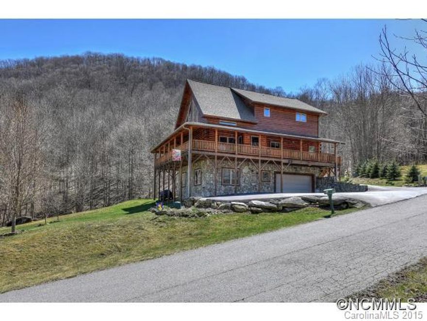 What everyone wants!Beautiful Mountain Log Home with fantastic view/roaring creek! Wrap-around deck,enclosed entryway,hrdwd flrs, fireplace, amazing kitchen w/granite,dual fuel range,stainless appl,lrg island. Living Rm w/cathedral ceiling/lots of windows to let the light in.Master on main is lovely. Lrg 2 b/r & bath upstairs.Den downstairs is comfy and inviting & 1 more b/r & bath.Landscaped to perfection/creek & views are awesome!$175/yr well