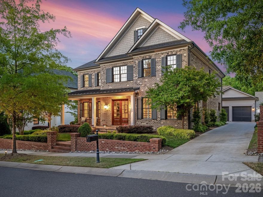 This stately brick home is nestled on one of the most beautiful streets in the sought-after neighborhood of Cotswold. With its timeless curve appeal, spacious layout, and warm, inviting interiors, this home, designed by award-winning Simonini Builders, feels like new. Full brick construction adds to the home’s beauty and ensures lasting durability and low maintenance. Step inside to well-appointed living spaces filled with abundant natural light complemented by thoughtful details throughout.   High end quality finishes include heavy moldings that add warmth and elegance, 4 ½” plantation shutters, 10’ ceilings downstairs, a gorgeous limestone mantle, engineered hardwood floors throughout much of the house and custom built-ins. The chef’s kitchen features top-of-the-line appliances and flows seamlessly into the living room. Disappearing sliding doors open to the beautiful covered patio and private, fenced backyard. Custom paver hardscaping adds warmth and elegance to the manicured lawn. The spacious main level primary suite includes a vaulted shiplap ceiling, spa-like bathroom, and expansive walk-in closet connected to the laundry room.  This is the perfect house for relaxing and entertaining!
The home is minutes away from favorite retail destinations, markets, restaurants and coffee shops, as well as Southpark, Uptown, the Briar Creek Greenway and 20 minutes to the airport. Combining style, comfort, and an unbeatable location, this home is a rare opportunity to enjoy the best of peaceful neighborhood living, cul-de-sac gatherings, sidewalk strolls and vibrant nearby amenities. Attached Tonal machine in the garage does not convey.