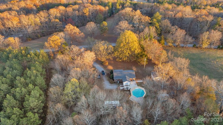 You're still looking for it, aren't you?  You know, for that property with a couple of acres, situated in a peaceful and private country setting, complete with ample space for gardening, raising a few chickens, or simply enjoying the outdoors.  The one featuring a single-level brick home, 3 BR and 1.5 BA, family room w/ built in gas fireplace, wide galley kitchen, a sun-drenched sunroom that leads to your backyard oasis - where you will enjoy sipping your morning coffee on the expansive patio or maybe take a dip in the in-ground salt water pool (5 1/2 ft deep).  2 separate wired workshops/storage buildings (16X20 & 8X10), and a separate dedicated electric RV hookup w/ water source.... Stop looking. It's.Right.Here. Located just outside the town limits of picturesque Hickory Grove SC, you will find it's an easy ride to York, Rock Hill, Gaffney & I-85.