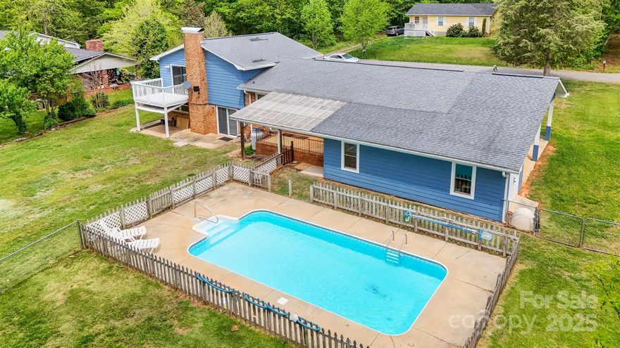 Welcome to this beautifully updated tri-level home, freshly painted and featuring durable luxury vinyl plank (LVP) flooring throughout. 3 bedroom / 2 bath and a large finished bonus area in the lower level. Upstairs, the primary bedroom boasts a private balcony, ideal for morning coffee or unwinding in the evening. Enjoy the convenience of a spacious carport with room for three vehicles, plus plenty of additional storage space for all your needs.

Step outside and dive into summer with your own in-ground pool—perfect for sunny days and entertaining. The fenced, level backyard offers both privacy and space for outdoor fun. 

Located in an area with lower county taxes, this home combines comfort, functionality, and value in one inviting package. Don’t miss out- schedule your showing today!