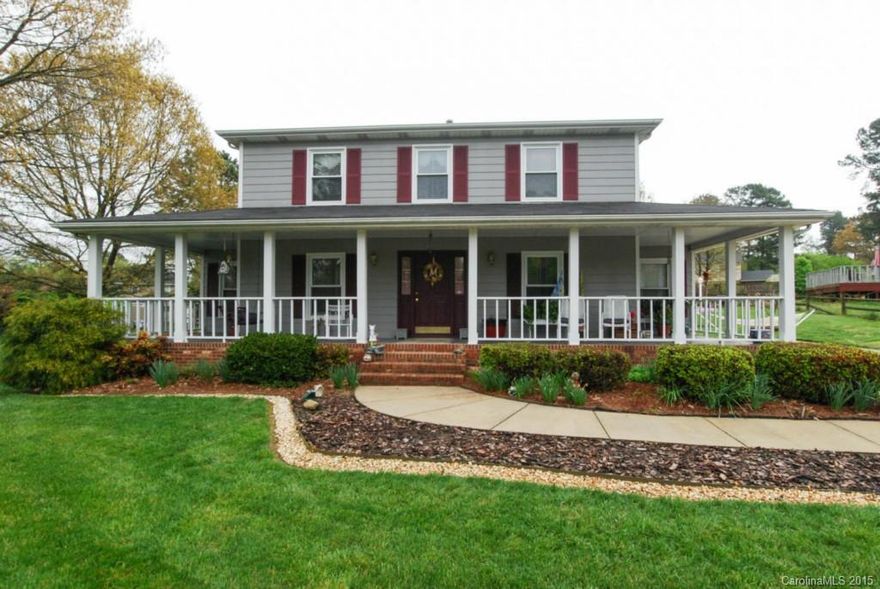 Gardeners Delight! Well Maintained 2 story home with wrap around front porch. New roof in 2012, Newer HVAC in 2003, Vinyl double pane windows. Family room with gas fireplace. Main level has laminate wood floors through out. Kitchen has corian counter tops. Beautiful large lot with many flower beds and trees-if you like working in your yard you will love this property! New trex deck installed in 2014. Large storage building for your lawn mower and all your gardening supplies.
