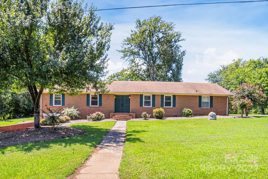 LOCATION! LOCATION! LOCATION! For sale AS-IS charming 1960's ranch home on a nearly 1/2 acre corner lot. This 3 bedroom, 2 bath home is ready for a makeover or could be a tear down to build a fabulous home like so many have done in this neighborhood. The house has a great layout with a kitchen open to a family room. With the size of this lot there is plenty of room to grow!  This home is minutes from I-77 and lots of restaurants and shopping. And it's just steps from the community lake access!