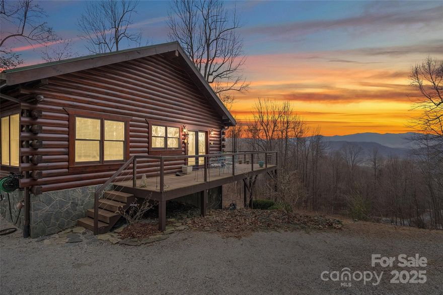 Located in beautiful Gateway Mountain, this stunning log home offers breathtaking views of Mount Mitchell. Featuring an open floor plan with expansive windows, this 3-bedroom retreat is bathed in natural light, bringing the outdoors in. Primary bedroom offers long range views and en suite bathroom. Features include radiant heated floors in all the bathrooms and an Aprilaire built-in humidifier/ dehumidifier. Enjoy the tranquility of nature from the wraparound deck, ideal for relaxing or entertaining. Finished basement offers exceptional living area with a fireplace, flex space and a second primary bedroom also with stunning views. This level could easily be a separate apartment if desired. Mountain living at its finest with privacy, modern comforts, and endless scenic beauty—all within a gated community with natural amenities just minutes from Black Mountain and Asheville. This home has never been in the rental program. Short term rentals are allowed here. Furnishings negotiable.