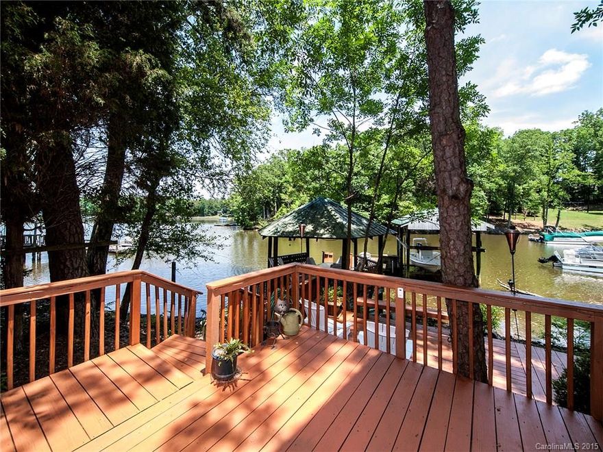 Major Price Reduction. Waterfront home in move-in condition. Home completely rebuilt in 2009; 1000 sq. ft.added up, downstairs  totally renovated.  Great room has  vaulted ceiling, hickory floors and fireplace. Kitchen has Granite, s/s apps., new cabs,and island. Master b/r upstairs with vaulted ceiling, master bath has tiled shower, htd. floors, dual sinks and garden tub. Spacious covered porch with expansive views. Floating dock, boat lift, gazebo and deck. Separate workshop with storage loft.