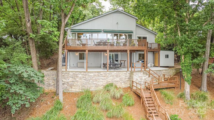 You will not believe the sunset over the water every evening! Water depth is approximately 9ft at the dock! This well-maintained residence will provide endless memories. Whether it is enjoying the fire pit area in the winter months or going out on the lake from your private dock including 2 boat lifts, relaxation and fun awaits. The main level includes the master bed and bath. There is an additional half bath on the main level for guests. The view of the lake is priceless from any room on the main level with floor to ceiling windows across the front going out to your private deck. There is an ice maker in the kitchen making sure you will not worry about a cold beverage while enjoying the water. Downstairs includes 2 additional large bedrooms, a living area, and full bath. The crawlspace was recently encapsulated for piece of mind. Schedule your showing today and see what all Tega Cay has to offer!