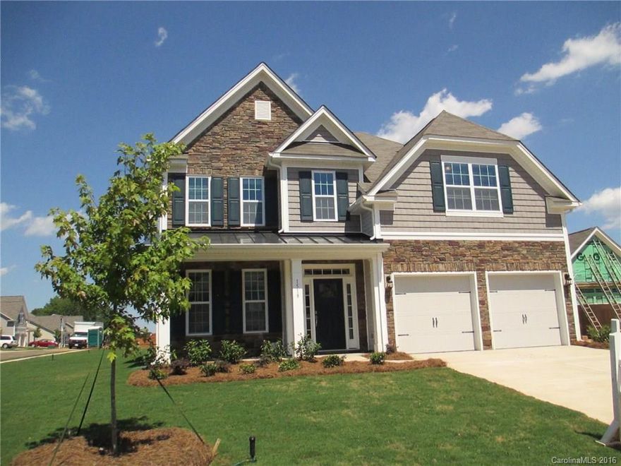 Beautiful 5 bedroom, 3 bath home- the 5th bedroom can be used as a bedroom or a bonus rm! This home called the "Fleetwood" is MOVE-IN READY! Gorgeous stone front w/ a rocking chair front porch. Large corner homesite w/ an awesome backyard (over a third of an acre). Open layout w/ Kitchen onlooking the family rm., which includes Fireplace, hardwoods  & beautiful trim detail. The kitchen is appointed w/kitchen island, granite countertops, stainless appliances, backsplash, pendants & recess lights.