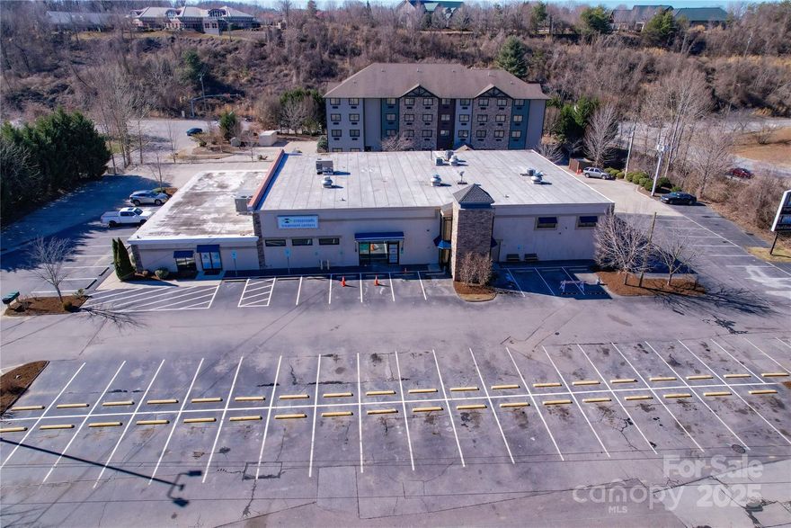 Strong in-place NOI with mark to market upside.  125 parking spaces / 6.5 per 1000 parking ratio.  Site features include access to traffic light and I-40 on/off ramps.  1.56 +/- acre site includes a pylon sign and an interior elevator.  This property is adjacent to Regional Medical Park and being 3 miles from Mission Hospital.  Potential 100,000/sf medical office redevelopment opportunity.