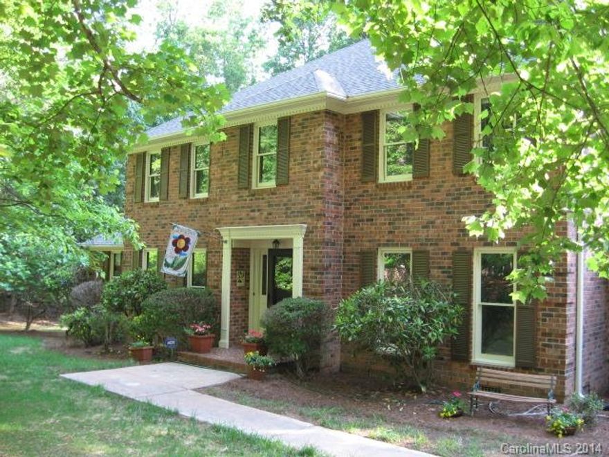 Most private lot in Providence Plantation. 2.07 acres, cul-de-sac location.  Screened porch and deck overlook private woods.  Updated kitchen with granite countertops, tile flooring.  New carpet throughout. Large living room, dining room, and den along with an over-sized recreation room all on the main level. 2 fireplaces. Large master bedroom with sitting area/library along with 3 additional larger bedrooms on second floor. Maintenance free brick exterior. Workshop in oversized 2 car garage.