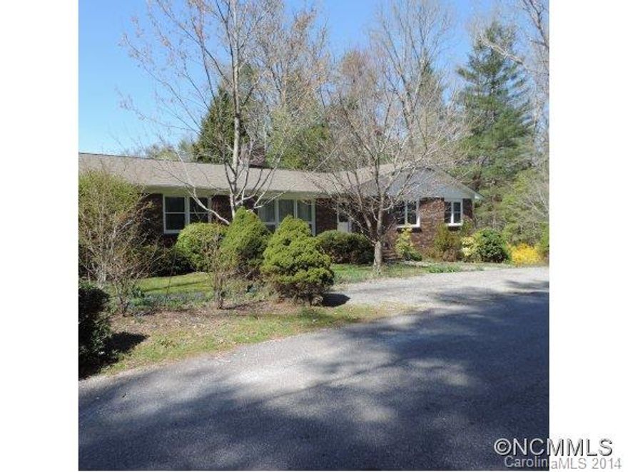Lovely Landscaping adorns this 4 Bedroom, 2 Bath, Brick Ranch. Enjoy in town living on 0.87 acres with a sunny garden spot. Just a short walk to the Library or the Center of Town. Easy transition indoors and out with the large Screened Porch. Formal Living Room, Dining Room and separate Den with Wood Burning Fireplace. Well Maintained Home that is move in ready!