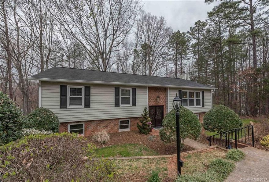 Dream home w/major updating including windows, kitchen, hvac, sunroom, hardwood, tile,wainscott,crown, fans,oversized gutters + downspouts, Archadeck engineered deck, custom $8,800 dual entry doors.Wonderful flowing floorplan w/grand great rm w/big window wall, beautiful kitchen w/granite,pull out drawers induction oven,glass front cabinets.Sunroom overlooks wooded yard and is finished in cedar w/vaulted ceiling.Huge garage.Den w/custom shelving plumbed for wet bar.Irrigation.Magnificent azaelas